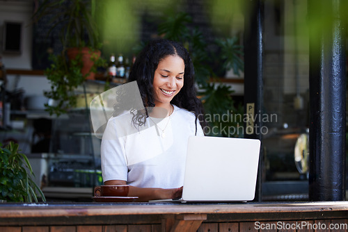 Image of Cafe, working and woman typing on laptop for online project, email or sales proposal. Freelancer, remote worker or happy female with digital computer for writing, networking or planning at restaurant