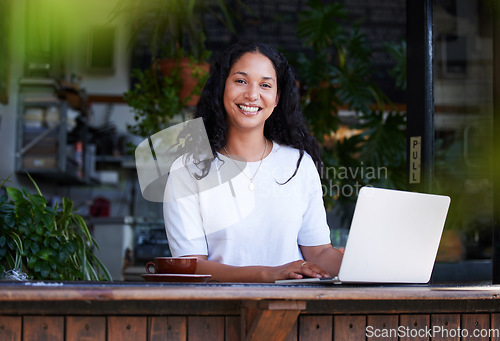 Image of Cafe, portrait and woman typing on laptop for online project, email or sales report. Freelancer, remote worker and happy female with digital computer for writing, networking or planning at restaurant