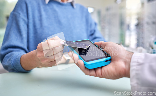 Image of Finance, hands or payment with a credit card by a customer shopping in a transaction at optometrist. Financial, zoom or people make a fintech electronic machine purchase or pos after eye care help