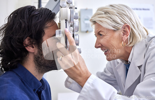 Image of Doctor with a customer in vision test or eye exam for eyesight by a senior optometrist or ophthalmologist. Happy optician helping check retina health of patient, man or client with medical insurance