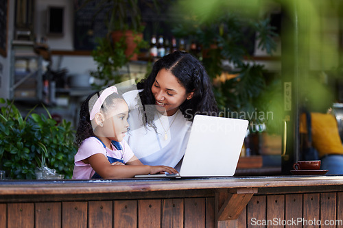 Image of Learning, mother and girl with laptop at cafe for education and development online. Family, remote worker and happy woman teaching kid how to type on computer at restaurant, bonding and having fun.