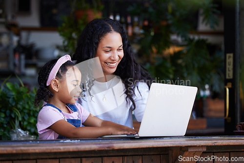 Image of Mother, learning and girl with laptop at cafe for education and development online. Family, remote worker and happy woman teaching kid how to type on computer at restaurant, bonding and having fun.