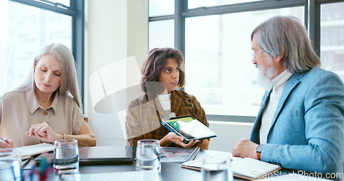 Image of Business people, tablet and teamwork for planning, strategy and ideas by desk in modern office for goal. Corporate group, digital tech and finance team for brainstorming, vision or target in New York