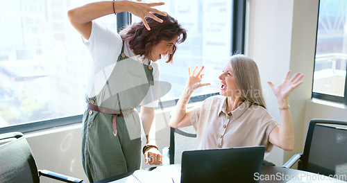 Image of Success, handshake and business women with a laptop, celebrate win and email motivation. Fist bump, teamwork and excited employees reading communication on a computer with a partnership celebration