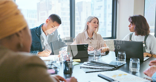 Image of Business people, tablet and teamwork for planning, strategy and ideas by desk in modern office for goal. Corporate group, digital tech and finance team for brainstorming, vision or target in New York