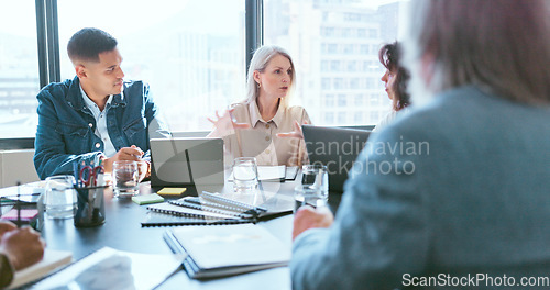 Image of Business people, tablet and teamwork for planning, strategy and ideas by desk in modern office for goal. Corporate group, digital tech and finance team for brainstorming, vision or target in New York