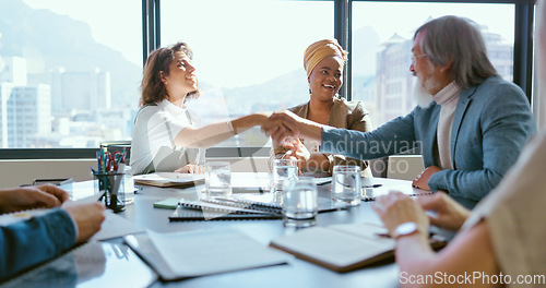 Image of Business people, handshake or office contract success in marketing office, advertising agency or branding company. Happy smile, creative designers or shaking hands, clapping and teamwork partnership