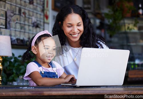 Image of Girl, learning and mother with laptop at cafe for education and development online. Family care, remote worker or happy woman teaching kid how to type on computer at restaurant, bonding or having fun