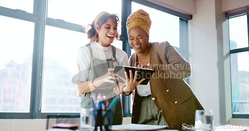 Image of Digital tablet, women and marketing team doing creative research for a project in their office. Collaboration, teamwork and female business partners checking their company website on a mobile device.