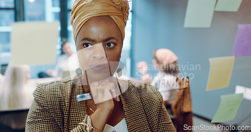 Image of Black business woman, post it and writing planning notes on glass wall for business meeting, presentation training or leadership in modern office. African woman, leader thinking and SEO strategy idea