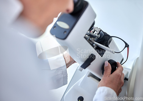 Image of Microscope, ophthalmology science and glasses with a woman doctor with tools to check lens. Medical person at work for vision and health insurance while working in lab, store or clinic for eye care