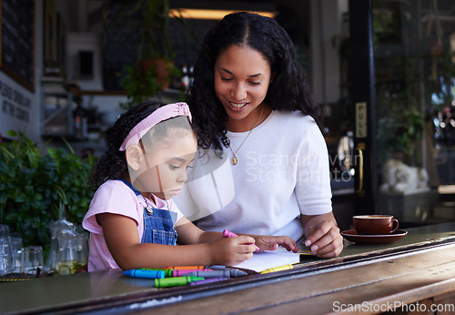 Image of Art, drawing and mother and child at a restaurant with an activity, creativity and color on paper. Creative, happy and girl learning to draw with her mom while eating at a cafe and waiting for food