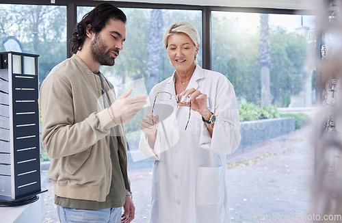 Image of Woman, optician and help man with glasses, optometry and retail shopping for vision services. Optometrist, eye care and choice of frames, lenses and happy customer consulting, health or wellness test