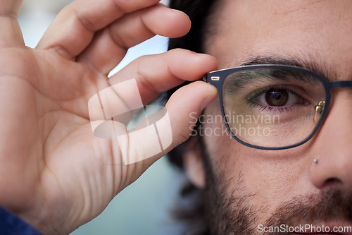 Image of Glasses, optometry and eye of man fitting prescription eyewear, spectacles and holding specs. Half, face and portrait of male person with new stylish frame for vision from optometrist or optician
