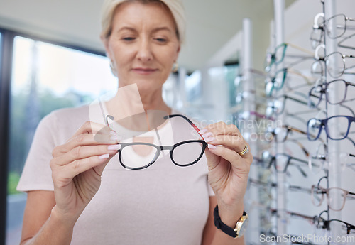 Image of Woman customer, glasses and eye care shopping for lens or frame for vision wellness with optometry. Happy senior person with choice or decision for retail sale with health insurance at optics store