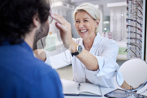 Image of Optician, happy woman and helping customer with eyes, glasses and vision in store. Face of optometrist, new frames and choice of consulting services in retail shop, clinic and health test of wellness