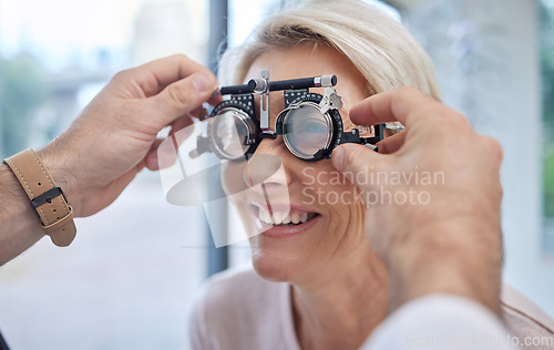 Image of Hands, help or woman in eye exam or vision test for eyesight by doctor, optometrist or ophthalmologist. Optician helping a happy customer to see or check glaucoma or retina health in a consultation