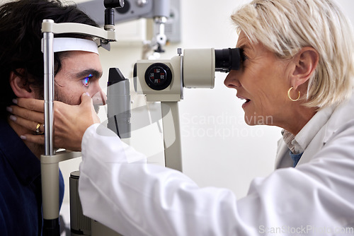 Image of Man, eye exam or test with patient and doctor at optometry consultation for lens or frame for vision. Person and healthcare woman with laser machine for eyes with expert care and health insurance