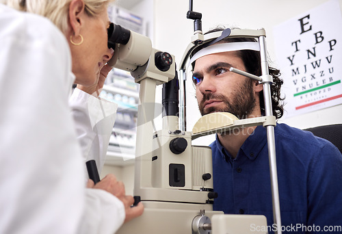 Image of Eye exam, vision test and patient with laser lens and doctor at optometry consultation. Face of a man and woman healthcare person with machine for eyes, wellness and health insurance with expert care