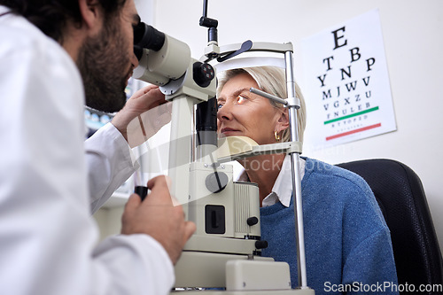 Image of Vision, machine exam and woman with an optometrist for a check, eye consultation and lens test. Healthcare, help and male optician with a senior patient to measure visual eyesight with equipment