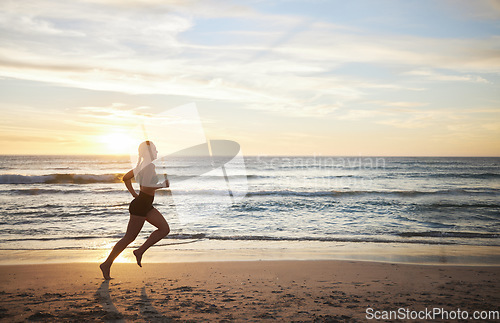 Image of Woman, fitness and running on the beach in sunset for healthy cardio exercise, training or workout on mockup. Female runner exercising in sunrise for run, health and wellness by the ocean coast