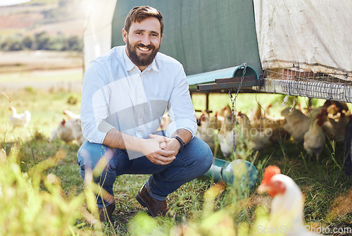 Image of Portrait, man on farm with chicken and agriculture, smile outdoor with poultry livestock with sustainability. Happiness, farming and environment, animal and farmer with organic free range product