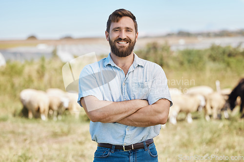 Image of Man, portrait or arms crossed on livestock agriculture, sustainability environment or nature land in ideas, vision or hope. Smile, happy or confident farmer and animals growth or sheep farming