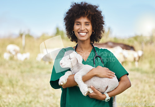 Image of Farm, portrait and woman holding sheep on livestock field for medical animal checkup. Happy, smile and female vet doctor doing consultation on lamb in agro, sustainable and agriculture countryside.
