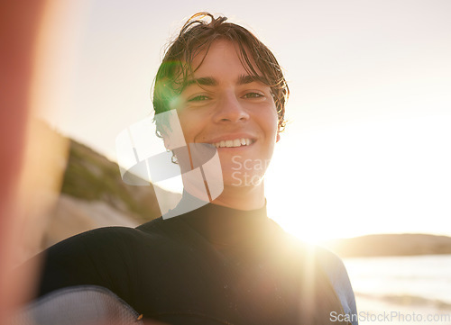 Image of Selfie, surf and beach with a sports man outdoor in nature on the sand by the sea or ocean for recreation. Portrait, face or surfing with a male athlete posing for a photograph outside in the morning