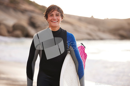 Image of Fitness, surfing and portrait of a man at the beach for water sports, happiness and holiday in Bali. Smile, training and surfer with a board for exercise, ocean break and activity on a vacation