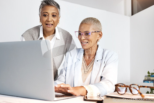 Image of Laptop, teamwork and support with a woman manager training an employee in the office at work. Computer, collaboration and help with a female coach or supervisor at an employee desk for assistance