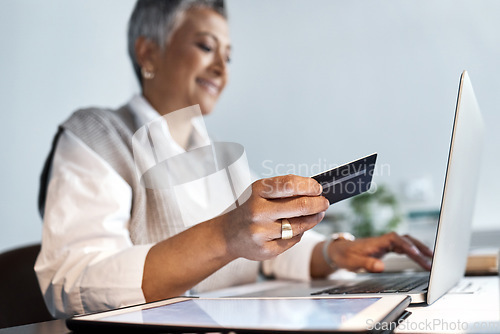 Image of Businesswoman, credit card and laptop for ecommerce, finance or accounting investment in office. Closeup of worker, budget and financial payment on computer, fintech trading or digital online economy