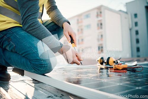 Image of Solar panel, city and construction worker hands with tools for renewable energy and electricity. Community innovation, roof work and engineering employ install eco friendly and sustainability product