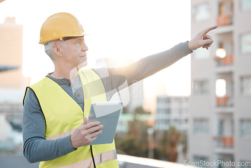 Image of Digital tablet, city and male construction worker working on building for maintenance, renovation or repairs. Leadership, contractor and senior man industry worker at a town site with a mobile device