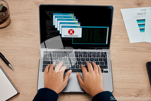 Image of Error, office and hands typing on a laptop working on a web development or design with a mistake. Technology, glitch and person type on a computer for a tech project in the internet in the workplace.