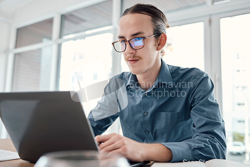 Image of Laptop, internet and businessman in office for email, typing and creative, design and idea on mockup background. Website, search and man seo busy on online project, task and problem solving in London