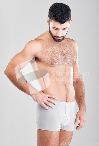 Image of Fitness, body and underwear with a man model in studio on a gray background for health or grooming. Aesthetic, muscle and manly with a handsome young male posing to promote wellness or lifestyle