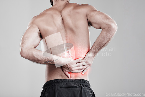 Image of Man, hands and back pain in x ray for injury, bruise or spinal ache against a gray studio background. Male model suffering from broken spine, inflammation or muscle holding painful bone or area