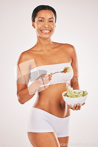 Image of Salad, portrait and body of woman isolated on a white background for diet, lose weight and healthy food promotion. Green vegetables, fitness and model person in underwear for detox results in studio