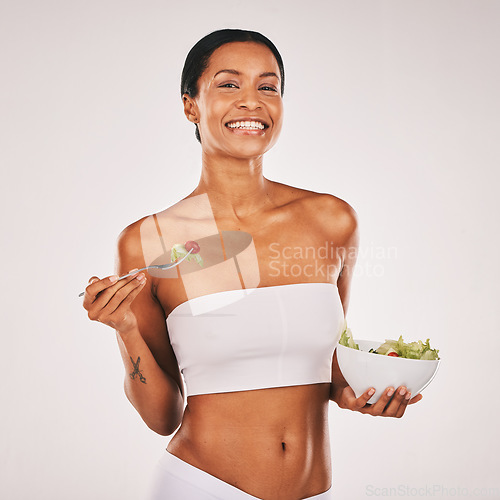 Image of Health, portrait or woman with a salad in studio for a healthy meal, nutrition diet or digestion benefits. Body goals, lose weight or happy female model eating food isolated on a white background