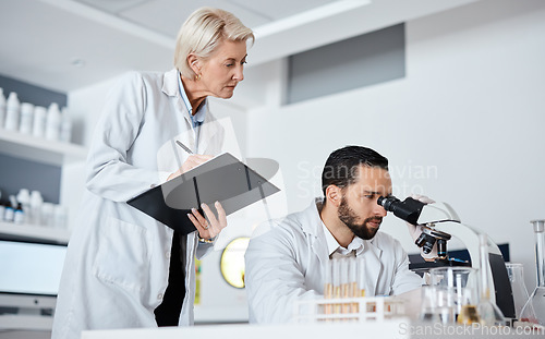 Image of Scientist man, woman and microscope with checklist in laboratory for research at pharma company. Science team, data analytics and biotechnology for goals, vision and study virus with teamwork in lab
