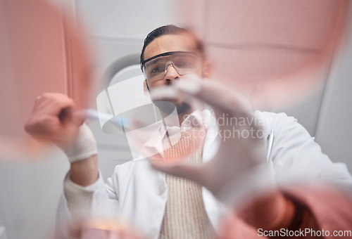 Image of Scientist, petri dish and pharma worker man working on science research in a laboratory. Medical container, study and thinking of a pharmaceutical solution of a lab employee with hospital data