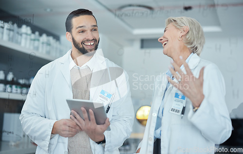 Image of Science, tablet and scientists talking in a lab working on scientific research, experiment or test. Happy, funny and professional researchers laughing in discussion with mobile device in a laboratory