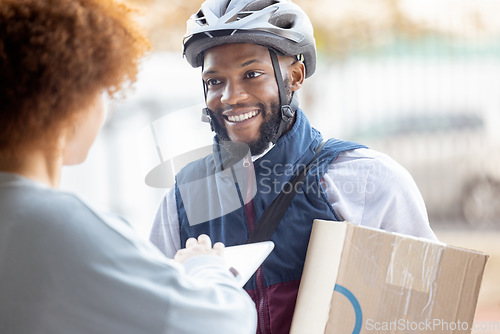 Image of Black man, box and smile for delivery service, package or female customer order in city. Happy African American male courier employee smiling or delivering cargo to woman with clipboard for signature