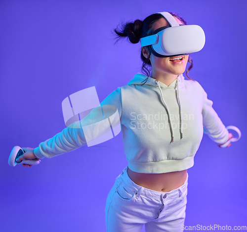 Image of Gamer woman, metaverse and virtual reality headset for futuristic gaming, cyber and 3d world. Happy person flying with hand controller for ar, digital experience and cyberpunk purple background app