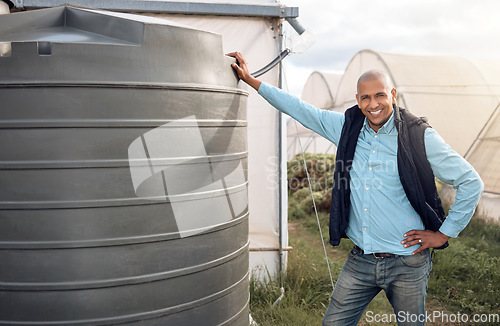 Image of Farmer, portrait and water tank in farming liquid or soil hydration for vegetables, food or crops growth. Irrigation, storage and agriculture container for watering conservation, smile or happy man