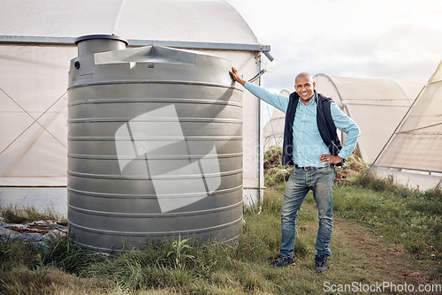 Image of Man, portrait and water tank in farming liquid or soil hydration for vegetables, food and crops growth. Irrigation, storage and agriculture container for watering conservation, smile or happy farmer