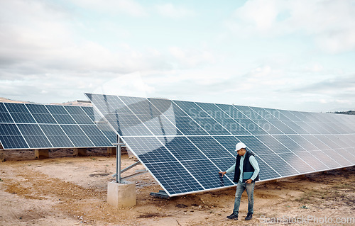 Image of Engineering man, solar panel inspection outdoor for renewable energy, sustainability and future of planet. Photovoltaic technology, clean electricity innovation and sustainable goals for earth safety