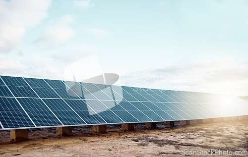 Image of Solar panels, renewable energy and engineering for sustainability, eco friendly and clean electricity background. Agriculture, photovoltaic grid design and countryside sun on blue sky mockup or space