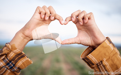 Image of Heart hands, agriculture and farming and countryside for sustainability, farming or agro business people in industry. Love emoji sign, farmer couple and plants growth on field sustainable development